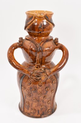 Lot 118 - Unusual lead glazed figure ewer, with inscription beneath