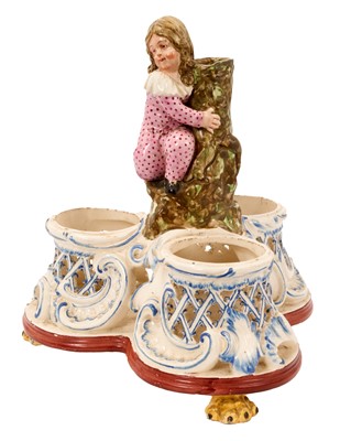 Lot 16 - Pearlware three bottle decanter stand, with figure handle, circa 1820