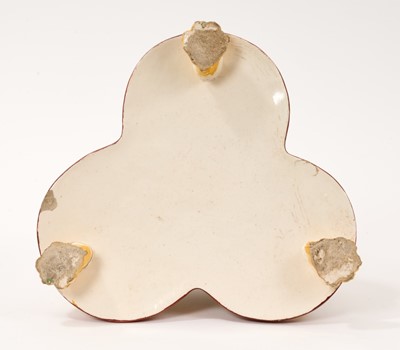 Lot 6 - Pearlware three bottle decanter stand, with figure handle, circa 1820