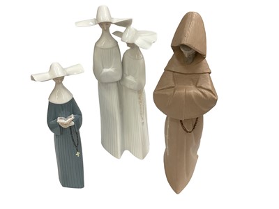 Lot 1210 - Three Lladro porcelain figures, Prayerful Moment (boxed), Nuns (boxed) and a Monk (unboxed)