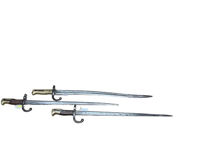 Lot 972 - French 1866 Pattern Chassepot bayonet and pair Gras bayonets (scabbards lacking)