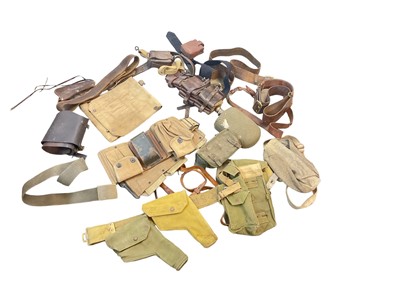 Lot 779 - Collection of canvas webbing holsters and belts, leather belts including Sam Browne and other related items (1 box).