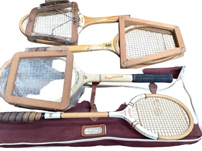 Lot 2531 - Four vintage tennis rackets in a canvas bag, including Dunlop and Slazenger