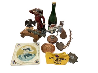 Lot 798 - Collection of assorted Militaria to include Civil Defence Warden arm band, V1 Flying Bomb 'Doodlebug' model and First World War ceramic teapot stand (1 box).