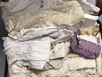 Lot 2115 - A suitcase of Edwardian lace and white-work cotton clothing including babiy christening gowns, nighties, petticoats, dresses, lace bonnet. Also women's split leg  combination, button back draws, ni...