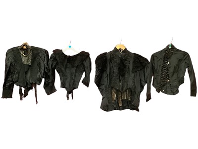 Lot 2116 - Four Victorian black bodices including bodice with lace front insert and tassel by Arthur Harrison, Boston, Lincolnshire, lace and grosgrain by Parker and Smith Boston, wide legof mutton sleeves, l...