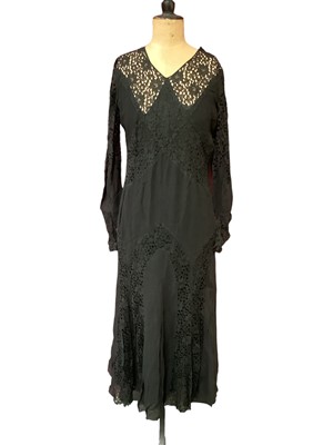 Lot 2118 - Two 1930's black evening dresses, one with black silk crepe and lace inserts, the other is black bocade and grosgrain. A black petticoat with lace short sleeves and a burgandy satin dress ( one sle...