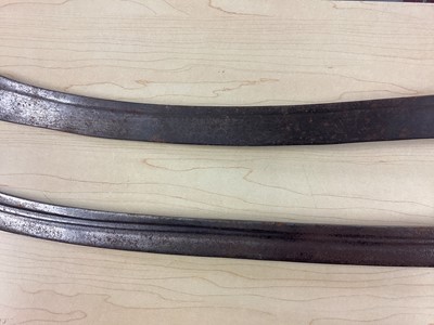 Lot 987 - Two 19th century Indian Tulwars with traditional disc hilts and curved fullered blades