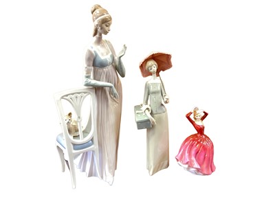 Lot 1214 - Two Lladro figures and a Royal Doulton figure