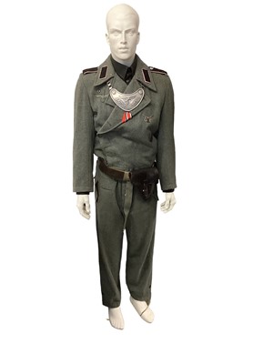 Lot 818 - Freestanding mannequin dressed in a replica Second World War Nazi German uniform including gorget and belt.