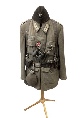 Lot 819 - Mannequin dressed with Second World War Nazi German Wehrmacht tunic, complete with accessories including bayonet and scabbard, belt and decorations. A mixture of original and reproduction items not...