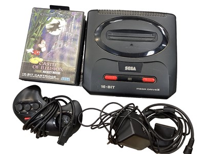 Lot 1983 - Boxed Sega Mega Drive II includes one controller and two games, Castle of Illusion starring Mickey Mouse and World of Illusion Starring Mickey Mouse and Donald Duck