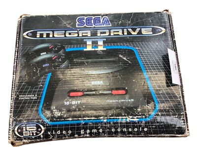 Lot 1983 - Boxed Sega Mega Drive II includes one controller and two games, Castle of Illusion starring Mickey Mouse and World of Illusion Starring Mickey Mouse and Donald Duck