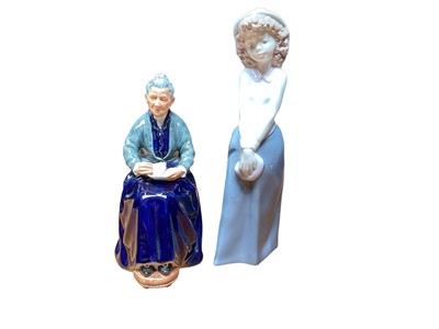 Lot 1212 - Royal Doulton figure - The Cup Of Tea HN2322, together with a NAO figure of a girl (2)