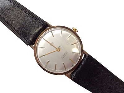 Lot 286 - 1960's Gentlemen's 9ct gold wristwatch with silvered dial, baton hour markers, on a black leather strap, case approximately 33mm in diameter.