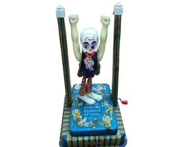 Lot 2048 - Selcon products Ltd tinplate and plastic man on a flying trapeze and kissing children electrically operated automation (2)