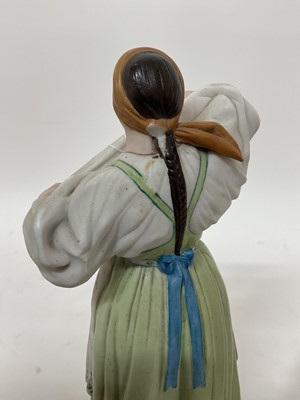 Lot 48 - Two Russian Gardner bisque porcelain folk figures
