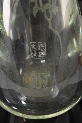 Lot 10 - Large and heavy Chinese carved glass vase, possibly Peking, decorated with a bird perched amongst branches, and calligraphy