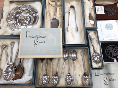 Lot 326 - Collection of Lindisfarne Silver with Celtic design, to include eight tea spoons, cake slice, pair of sugar tongs, eight dessert spoons, ashtray, butter knife and 'Roman' spoon, all in original box...