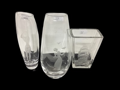 Lot 1226 - Kosta glass vase with etched nude female decoration, signed, together with two other etched glass vases (3)