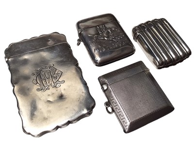 Lot 306 - Edwardian silver card case, (Chester 1906), together with three silver vesta cases, (Birmingham 1890), maker George Unite, (Chester 1923) and a Continental silver vesta case decorated with jockeys...