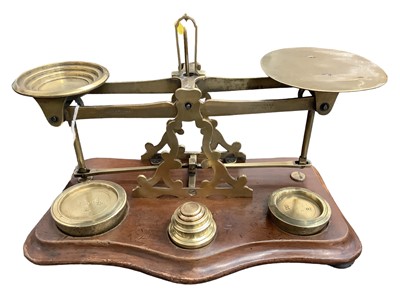 Lot 2541 - Pair good quality Victorian brass parcel scales marked 'William Mitchell's improved warranted accurate' on shaped mahogany plinth 29cm wide complete with brass graduated weights