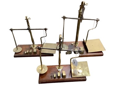 Lot 2547 - Three sets of De Grave, Short & Fanner brass and mahogany postal scales, including one with GPO stamp