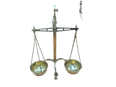 Lot 2550 - Set of antique brass sovereign/money scales by White & Son, on tripod feet, 46cm high