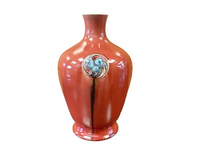 Lot 1237 - William Moorcroft for Liberty and Co., a large Flamminian red vase, circa 1906, footed ovoid shouldered form with three incised foliate roundels, incised signature to base, 39cm high