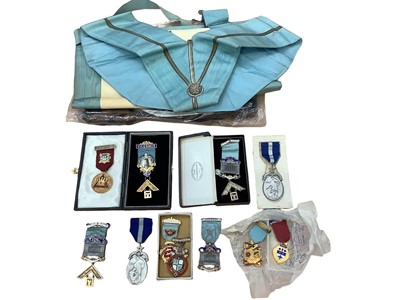 Lot 2625 - Group of eleven silver and gilt metal Masonic jewels together with related regalia and ephemera in suitcase.