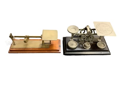 Lot 2548 - Pair Victorian nickel plated postal scales by S.Morden & Co, London with nickel plated weights on ebonised plinth and pair brass beam postal scales by the same maker (2)