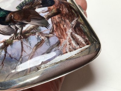 Lot 315 - Early 20th century Continental silver and enamel cigarette case of rectangular cushion cover, the front enamelled with a capercaillie in a Scottish woodland scene, marked 935, 9cm in length.