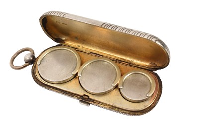 Lot 317 - Early 20th century Russian silver coin case of oval form with reeded decoration, the interior with spaces for 20, 10 and 5 ruble coins, 9.5cm in length.