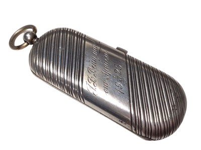 Lot 317 - Early 20th century Russian silver coin case of oval form with reeded decoration, the interior with spaces for 20, 10 and 5 ruble coins, 9.5cm in length.