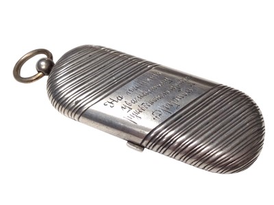 Lot 317 - Early 20th century Russian silver coin case of oval form with reeded decoration, the interior with spaces for 20, 10 and 5 ruble coins, 9.5cm in length.