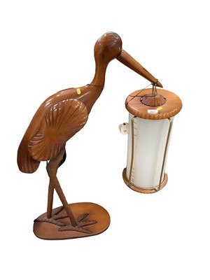 Lot 2652 - Unusual free standing lamp in the form of a stork, holding a lantern in its beak, 100cm in overall height.