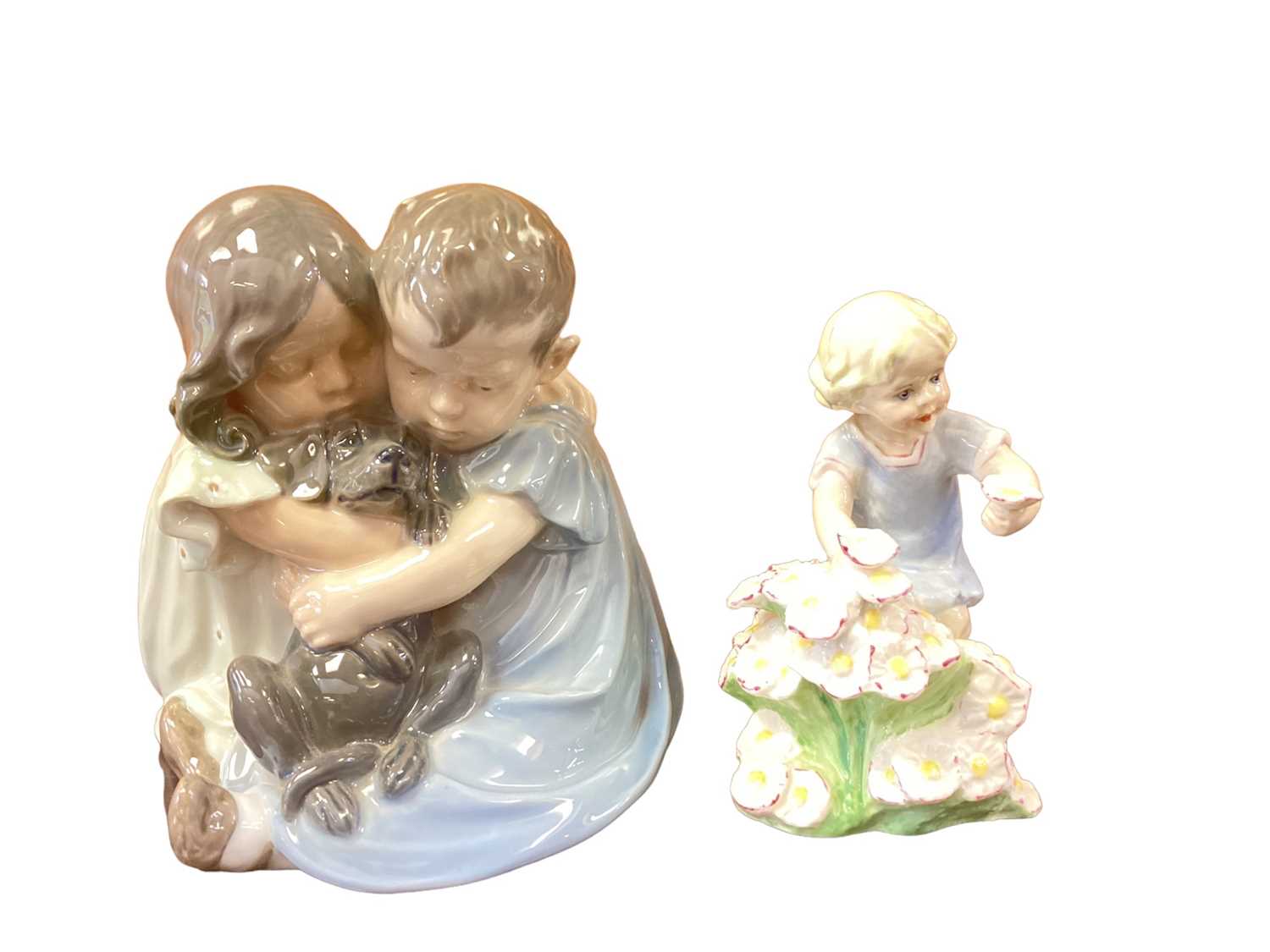 Lot 210 - Royal Copenhagen figure group - seated boy and girl with dog, no. 707 together with a Royal Worcester figure - May (2)