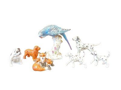 Lot 1256 - Group of five Royal Worcester and other dogs, Royal Worcester fox group and a Royal Worcester bird (7)