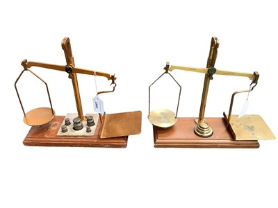 Lot 2562 - Two sets of brass and mahogany GPO balance scales, including one by De Grave, Short & Co., with weights