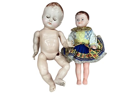 Lot 1770 - German bisque porcelain doll with blue eyes and two other dolls.