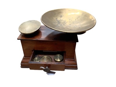 Lot 2567 - Set of Victorian brass and mahogany scales, the single drawer with ornate handle, Victorian registration mark, weights inside, 20cm high