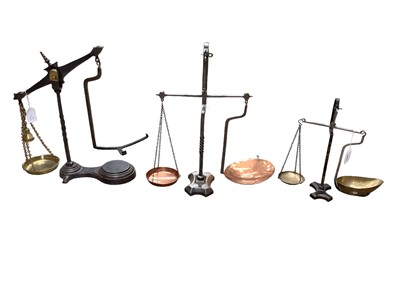 Lot 2571 - Three sets of Victorian iron, brass and copper scales, including two with twisted columns, the other by Avery