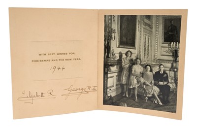 Lot 16 - T.M. King George VI and Queen Elizabeth, scarce wartime 1944 Christmas card with gilt embossed crown to cover, black and white photograph of the King and Queen with their two daughters in Buckingh...