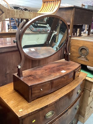 Lot 1280 - Nineteenth century mahogany bowfronted toilet mirror on base with oval plate, the base fitted with three drawers, on bracket feet, 78.5cm wide