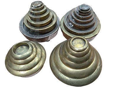 Lot 2580 - Four sets of graduated brass weights, with many with Victorian registration marks, some marked Imperial Standard