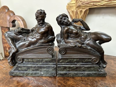 Lot 1527 - Pair of bronze bookends after Michaelangelo