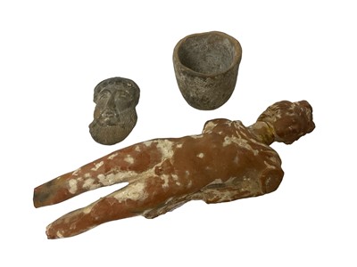 Lot 1629 - Classical terracotta male funery figure