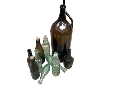 Lot 2619 - Large antique glass bottle together with box containing cod bottles and other antique glass bottles.