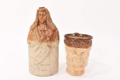 Lot 134 - 19th century Lambeth brown stoneware flask, modelled as a three quarters figure of the Lord Chancellor, Lord Brougham, holding a scroll inscribed 'The True Spirit of Reform' above 'Brougham's Refor...