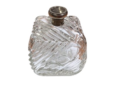 Lot 358 - Edwardian Cubist style glass cologne bottle with silver screw top, (London 1908) 12.5cm high